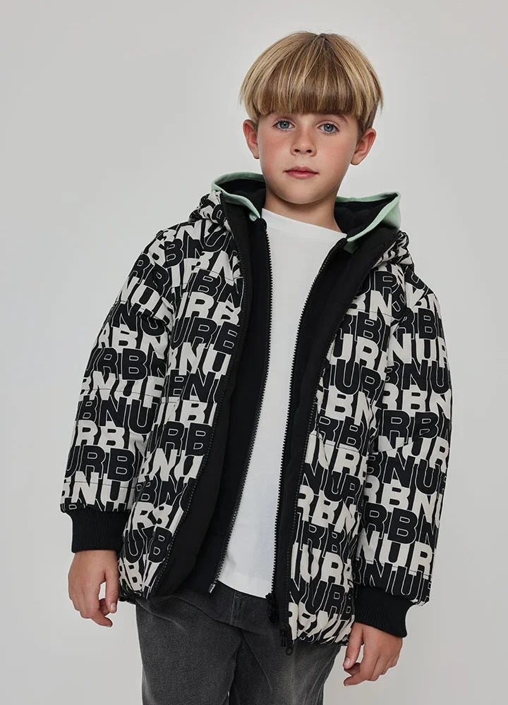 Abrigo reversible niño Boboli negra y estampada