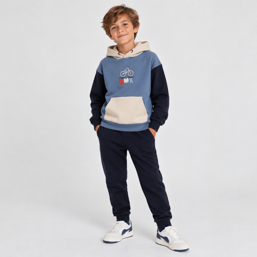 Niño con conjunto chándal BMX Street Monkey azul marino y beige